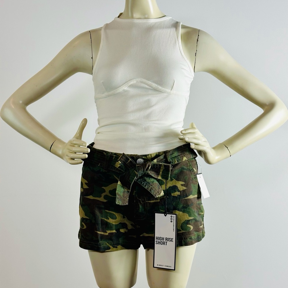 Camouflage High Rise Shorts. Attached bow in the front. All tags attached. New.